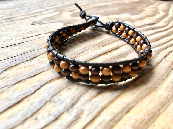 Two toned wooden brown wrap bracelet with tree of life clasp on leather cord